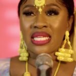Mariam Ba Lagaré shining in traditional rich bazin clothing and gold jewelry