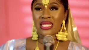 Mariam Ba Lagaré shining in traditional rich bazin clothing and gold jewelry