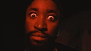 Malian lyricist DR KEB performing in his dark-themed official music video for Kabourou